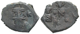 Constans II, Constantine IV, Heraclius and Tiberius, AD 641-668. AE, Follis. 3.81 g. 21.76 mm. Constantinople.
Obv: Helmeted bust of Constans facing, ...