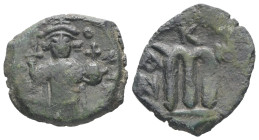 Constans II, AD 641-668. AE, Follis. 3.79 g. 20.39 mm. Constantinople.
Obv: [EN T૪ - TO NIKA]. Constans II standing facing, wearing crown surmounted b...