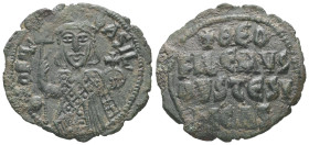 Theophilus, AD 829-842. AE, Follis. 5.74 g. 30.96 mm. Constantinople.
Obv: ΘEOFIL-bASIL. Crowned, three-quarter length figure of Theophilus facing, pe...