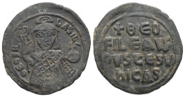 Theophilus, AD 829-842. AE, Half Follis. 4.68 g. 25.72 mm. Constantinople.
Obv: ΘEOFIL-bASIL. Crowned, three-quarter length figure of Theophilus facin...