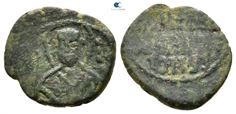 Ruggero II AD 1105-1154. Messina
Follaro Æ

15 mm.,1,45 g.



very fine