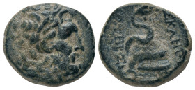 MYSIA. Pergamon. (Mid-late 2nd century BC). AE Obv: Laureate head of Asklepios right.
Rev: ΑΣΚΛΕΠΙΟΥ / ΣΩΤΗΡΟΣ. Serpent coiled right around omphalos....