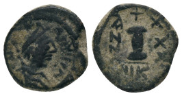 JUSTINIANUS I. (527 - 565). Decanummium. Nicomedia.Ae.
Obv: Bust with diadem, paludament and armor on the right.
Rev: Stamp I between ANNO and XXX I...