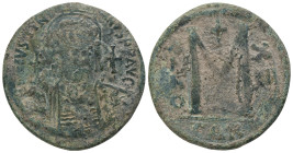 JUSTINIAN I.(527-565).Constantinople.Follis.
Obv : D N IVSTINIANVS P P AVC.
Helmeted, cuirassed bust facing, holding cross on globe and shield with ...
