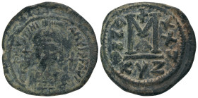 JUSTINIAN I.(527-565).Cyzicus.Follis.
Obv : D N IVSTINIANVS P P AVC.
Helmeted, cuirassed bust facing, holding cross on globe and shield with horsema...