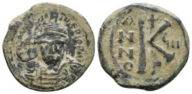 MAURICE TIBERIUS (582-602). Half Follis. Antioch.
Ob v: d N mAYΓI CN P AYΓ.
Crowned facing bust, wearing consular robe, holding mappa and eagle-tipp...