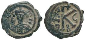 MAURICE TIBERIUS.582-602 AD.Constantinople mint.AE Half follis. D N mAVRICI TIbER P P AV; helmeted and cuirassed bust of Maurice Tiberius facing holdi...
