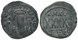 PHOCAS. 602-610 AD.Cyzicus mint.AE Follis.Crowned facing bust, wearing consular garb, holding mappa and cross; cross in left field / : Large XXXX; abo...