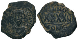 PHOCAS. 602-610 AD. Constantinople mint.AE Follis. DM FOCAE PP AVG, crowned, mantled bust facing, holding mappa and cross / Large XXXX, ANNO above, re...
