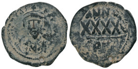 PHOCAS. 602-610 AD. Constantinople mint.AE Follis. DM FOCAE PP AVG, crowned, mantled bust facing, holding mappa and cross / Large XXXX, ANNO above, re...
