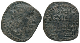 ARTUQID of MARDIN.Husam al-Din Timurtash.1122-1152 AD. No Mint & No Date. AE dirhem.
Obv : Diademed Seleukid style bust right.
Rev : الملك العالم / ...