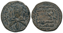 AYYUBIDS.al Adil I Sayf al Din Ahmad.1193-1200 AD.Mayyafariqin Mint.591 AH. AE Fals.
Obv : Crowned and draped bust facing.
Rev : Kalima and name of ...