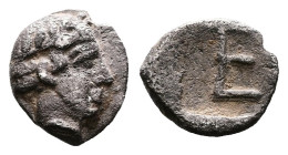Ionia, Kolophon, circa 420-400 BC. AR Tetartemorion (6.3 mm, 0.28 g.). Laureate head of Apollo to right. Rev. Rev. Large TE as a mark of value (abbrev...