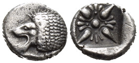 Ionia. Miletos circa 525-475 BC. Diobol AR (1.2 Gr. 9mm.)
Forepart of lion to right, his head turned back to left 
Rev. Star-shaped floral ornament wi...