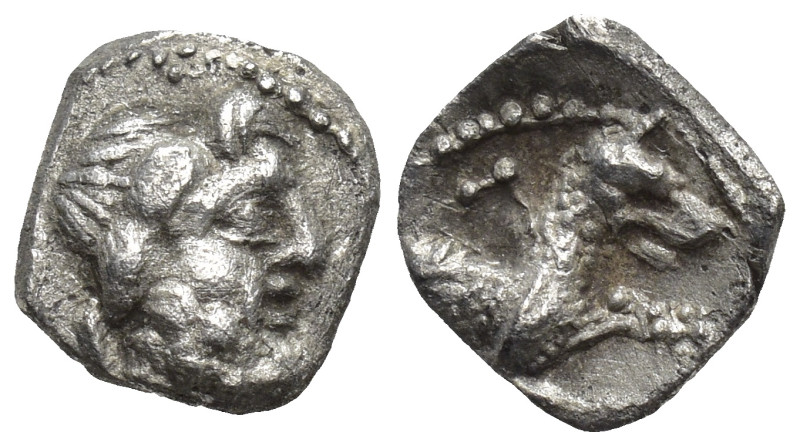 Lycaonia, Laranda AR Obol (8mm, 0,5 g) ca 324/3 BC. Obv. Head of Herakles to rig...