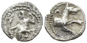 Lykaonia, Laranda AR Obol. Circa 324/3 BC. (10mm, 0,56 g) Baaltars seated left, holding grain ear, grape bunch, and sceptre Rev. Forepart of wolf righ...