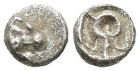 Asia Minor, Uncertain. 5th. Century BC. AR Tetartemorion (5mm, 0.27 g). Head of eagle right. Rev. Circular symbol (wreath or diadem?) letter or monogr...