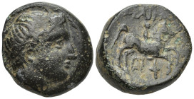 Kings of Macedon. Philip II (359-336 BC). AE (18mm, 8.0 g). Obv. Head of Apollo right, wearing tainia. Rev. ΦΙΛΙΠΠΟΥ, Youth on horseback right, torch ...