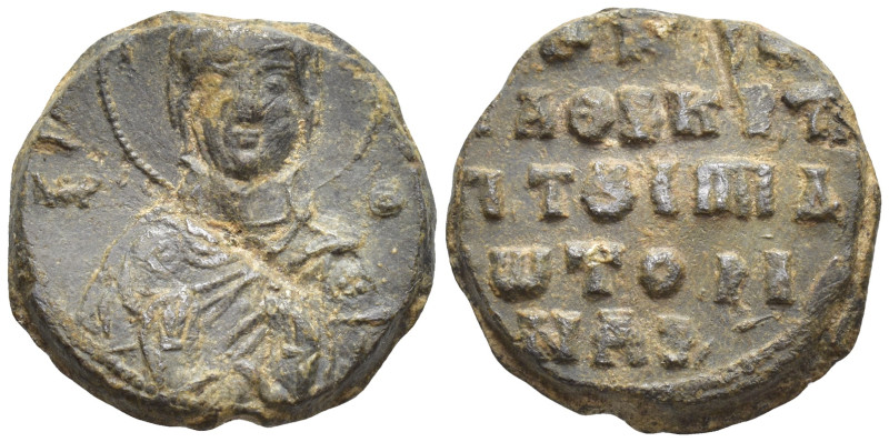 Bust of the Mother of God, nimbate, holding before her the medallion of the Chri...
