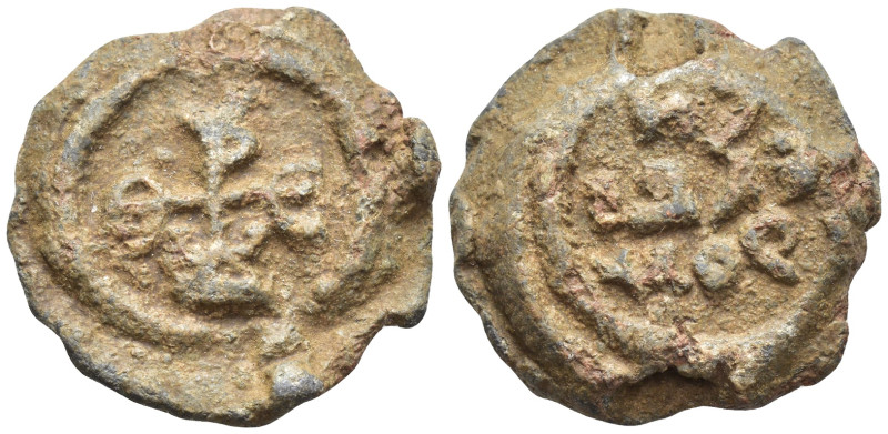 Byzantine Lead Seal, (23mm, 12.6 g) Cruciform monogram;. / Legends in three line...