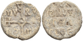 Cruciform invocative monogram 
Inscription in four lines (13 Gr. 23mm.)
