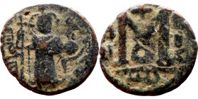 al-Malik ibn Marwan (687-705), Constans II style folis Obverse: Imperial figure holding globus Reverse: m and inscription