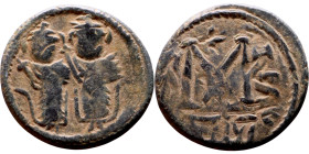 al-Malik ibn Marwan (687-705), Constans II style folis Obverse: Imperial figure holding globus Reverse: m and inscription