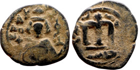 al-Malik ibn Marwan (687-705), Constans II style folis Obverse: Imperial figure holding globus Reverse: m and inscription