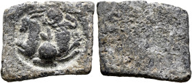 Anonymous, 2nd-3rd centuries. Tessera (Lead, 18x15 mm, 7.78 g). Two protomes emerging to left and right from central globe; the one on the left a goat...