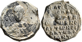 Gregorios Karianites, imperial notarios of the oikeiakon, 11th century. Seal (Lead, 24 mm, 18.30 g, 12 h). [Θ NI]/KO... Nimbate facing bust of Saint N...