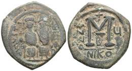 Byzantine  Justin II and Sophia, AE, Follis. (Bronze) Nicomedia. 565-578 AD. Obv: [DN IVSTI]NVS PP [AVG], Justin II and Sophia nimbate and seated on l...