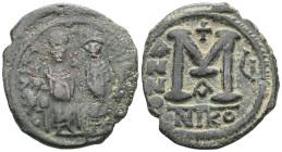 Byzantine  Justin II and Sophia, AE, Follis. (Bronze) Nicomedia. 565-578 AD. Obv: DN IVS[TI]NVS PP AV[G], Justin II and Sophia nimbate and seated on l...