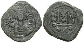 Byzantine Maurice Tiberius, 582-602. Follis (Bronze), Nicomedia, 586-587. D N MAVRIC TIbЄRI P Helmeted and cuirassed bust of Maurice Tiberius facing, ...