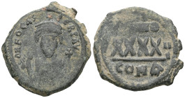 Byzantine  Phocas, AE, follis, (Bronze) Constantinople. 602-610 AD. Obv: DN FOCAS PE[RP AVG], crowned, mantled bust facing, holding mappa and cross, c...