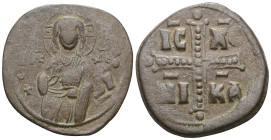 Byzantine Anonymous, attributed to Michael IV (1034-1041) AE Follis (Bronze) Constantinople . Obv: +EMMANOVH? IC - XC, Three-quarter length figure of ...