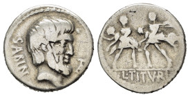 L. TITURIUS L.F. SABINUS (89 a.C.). Denario per Roma. AR (g 3,93). Testa barbata del re Tazio a destra; monogramma TA a destra. R/ Ratto delle Sabine:...