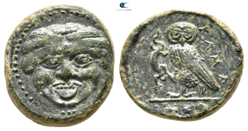 Sicily. Kamarina 420-405 BC. 
Tetras Æ

16 mm., 3,30 g.

Facing gorgoneion ...