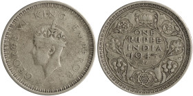 INDIA / BRITISH: 1 Rupee (1943) in silver (0,500). Small second head of George VI facing left and large rim decoration on obverse. Denomination and da...