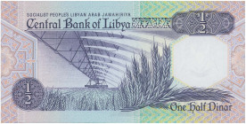 LIBYA: 1/2 Dinar (ND ca.1990) in deep purple and aqua on multicolor unpt. Oil refinery at left center on face. S/N: "4 D/1 056082". WMK: Heraldic falc...