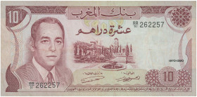 MOROCCO: 10 Dirhams (1970 / AH1390) in brown on light green and multicolor unpt. King Hassan II at left, Villa at center on face. S/N: "BB/91 262257"....