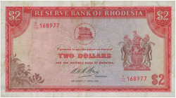 RHODESIA: 2 Dollars (7.4.1975) in red on multicolor unpt. Bank logo at upper center, coat of arms at right on face. S/N: "K/116 1688977". WMK: C. Rhod...