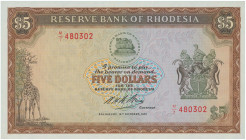 RHODESIA: 5 Dollars (16.10.1972) in brown on multicolor unpt. Bank logo at upper center, coat of arms at right, giraffe at lower left on face. S/N: "M...