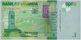 UGANDA: 5000 Shillings (2013) in green on multicolor unpt. World War I and II memorial of Constitutional Square in Kampala on face. S/N: "AS9398141". ...