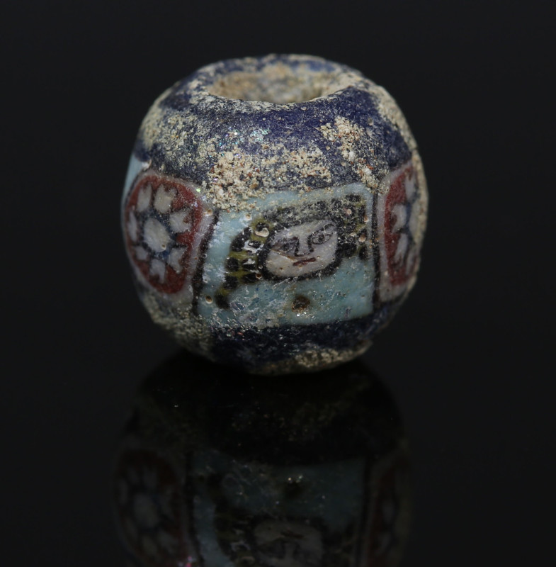 Romano-Egyptian face bead, probably Medusa

ITEM: Face bead, probably Medusa
...