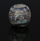 Romano-Egyptian face bead, probably Medusa