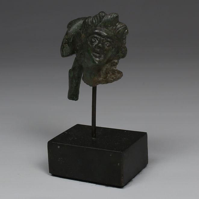 Roman head of Apollo

ITEM: Head of Apollo
 MATERIAL: Bronze
 CULTURE: Roman...