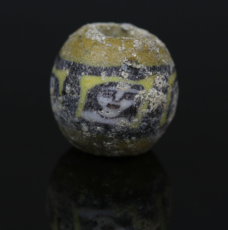 Romano-Egyptian face bead, probably Medusa

ITEM: Face bead, probably Medusa
...