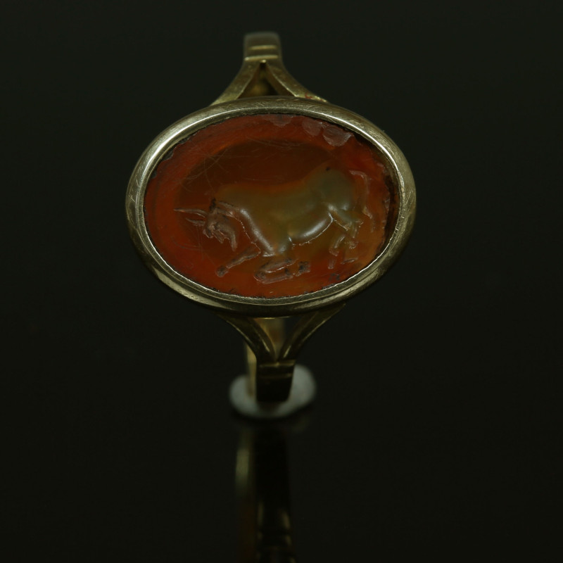 Modern gold ring with Roman gem depicting a bull

ITEM: Modern ring with Roman...
