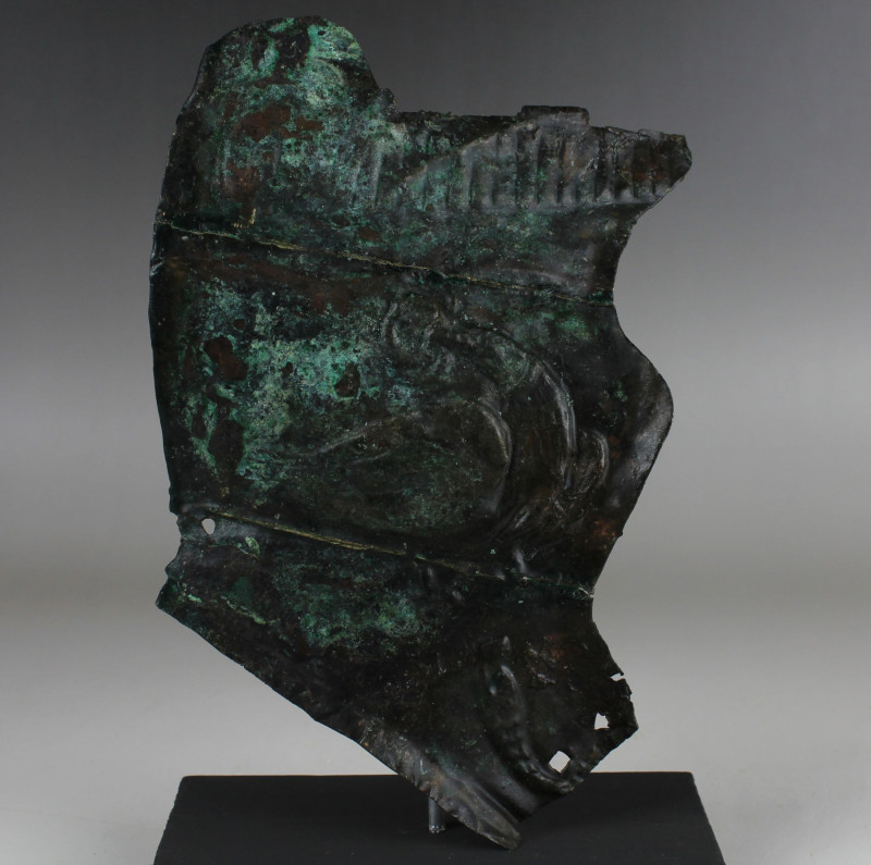 Roman military cheek piece of a helmet fragment with Jupiter’s eagle

ITEM: Mi...