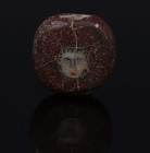 Romano-Egyptian face bead, probably Medusa